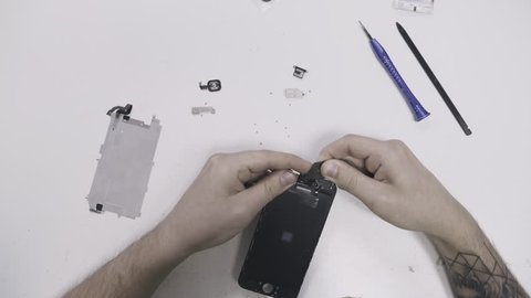 Technician repairing smartphone in the lab. 4K