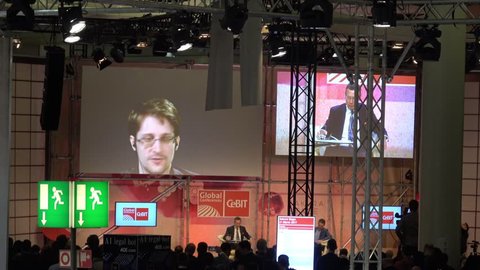 Hannover, Germany - March, 2017: Edward Snowden live video conference on exhibition fair Cebit 2017 in Hannover Messe, Germany