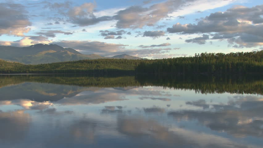 Late afternoon/early evening clouds over an Alaskan lake.