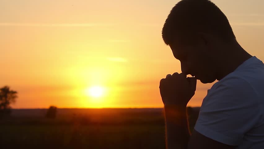 Silhouette of a Man Praying : vídeo stock (100% livre de direitos ...