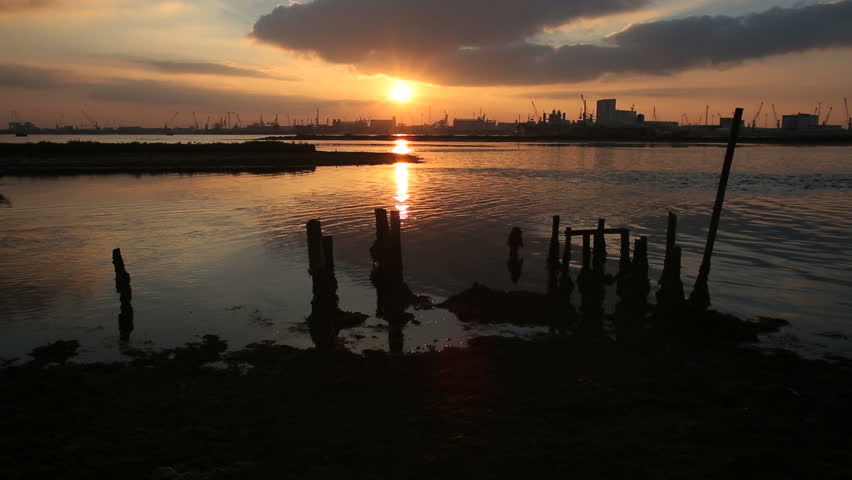 Sunset over the industrial region of Porto Corsini, Ravenna, Italy, with small