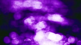 Beautiful glamour bokeh of defocused Christmas lights in shades of violet. 3840x2160