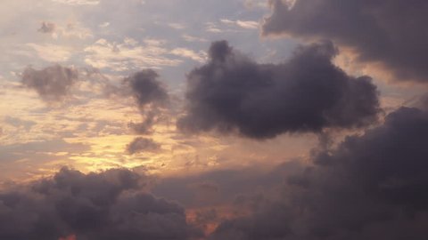 Time lapse beautiful sunset on the cloudy sky 