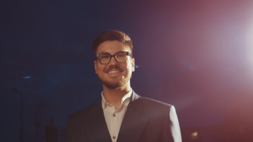 Award ceremony concept, young male happy smiling actor glasses with attractive beard on red carpet walking, show sincerely emotions empathy for his fans, triumph celebrity lifestyle winner Oscar star Royalty-Free Stock Footage #31044763