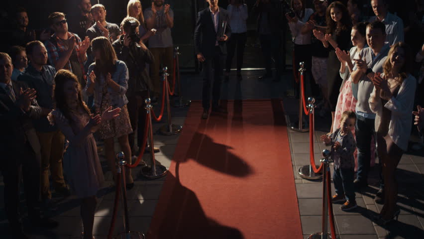 Back-sided scene, famous people award concept, young smart bearded man clothes walking across red oscar carpet, people waiting award ceremony famous actor, trophy prize hype fame famous star reward Royalty-Free Stock Footage #31044766