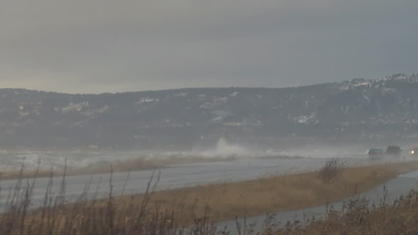 Storm-driven waves lash the breakwater of the Spit Road that connects Homer,