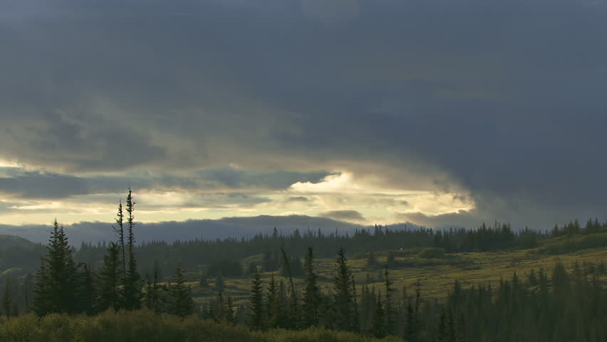 Slower version of incredible clouds moving over Alaskan countryside vista in