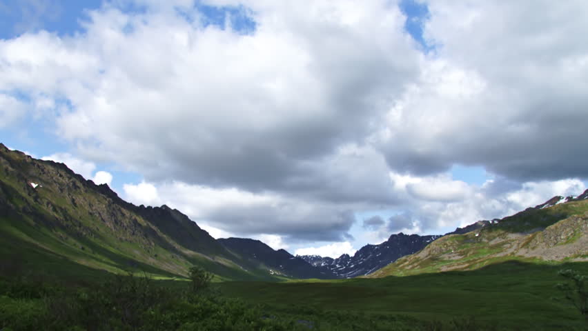 Mild timelapse clouds looking north up a valley in the Talkeetna range of Alaska