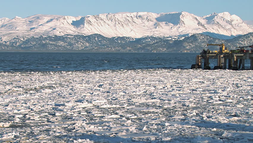 An Alaskan fishing/crabbing vessel returns to Homer Harbor, edging around the