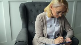 Middle aged woman busy with documents