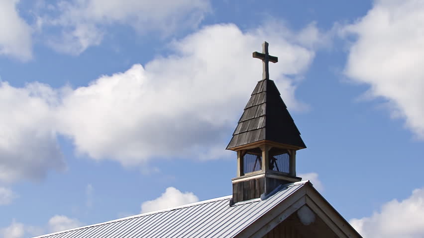 A cloud and shadow timelapse shot with the steeple of the church at the 108-Mile