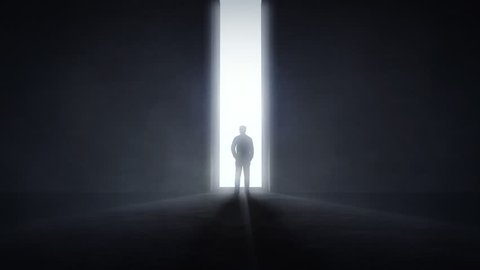 Man standing in the front of an opening light tunnel, opportunity concept
