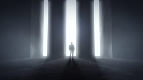 Man standing at opening glowing light tunnels in front of a high concrete wall, decision concept