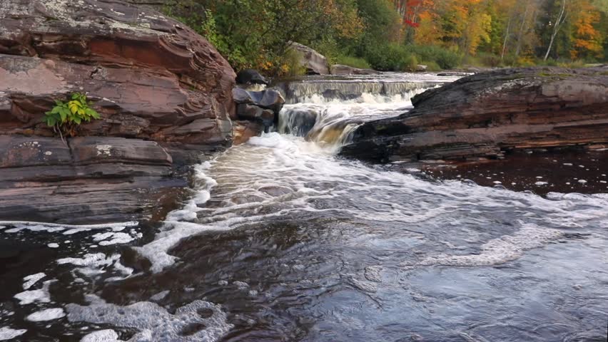 Bonanza Falls in Autumn. Big Iron River spills over Bonanza Falls near Silver City, in Michigan