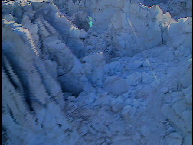 Low level fly over heavily crevassed and melting glacier