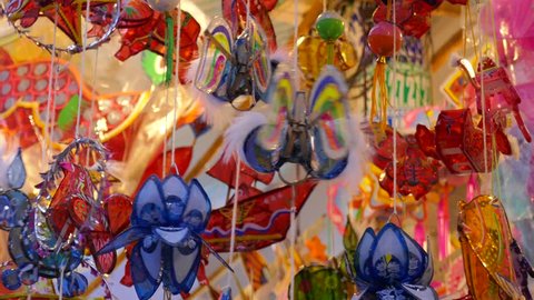 Traditional culture on mid autumn in lunar year, local people sell lanterns on Luong Nhu Hoc street. People visit, buy lantern, take photo with colorful lanterns. On lanterns not brand name or logo Stock Video