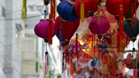 Traditional culture on mid autumn in lunar year, local people sell lanterns on Luong Nhu Hoc street. People visit, buy lantern, take photo with colorful lanterns. On lanterns not brand name or logo 库存视频