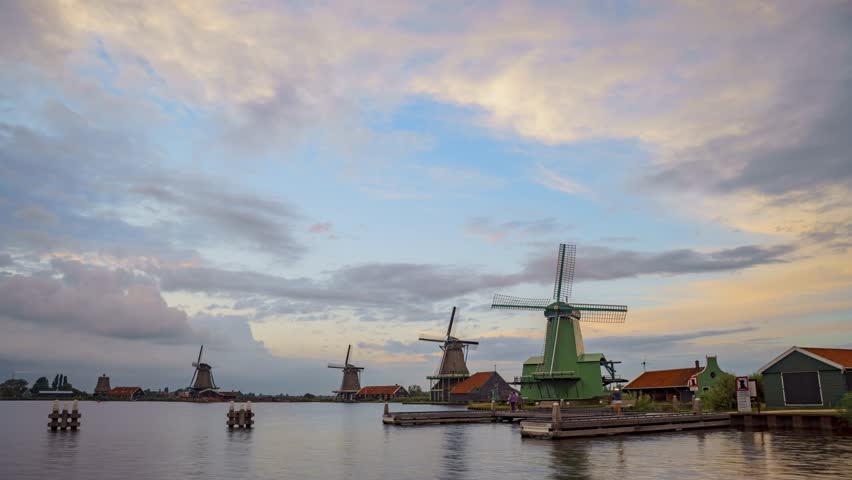 Timelapse of typical Dutch windmills at sunset, Zaanse Schans, Netherlands