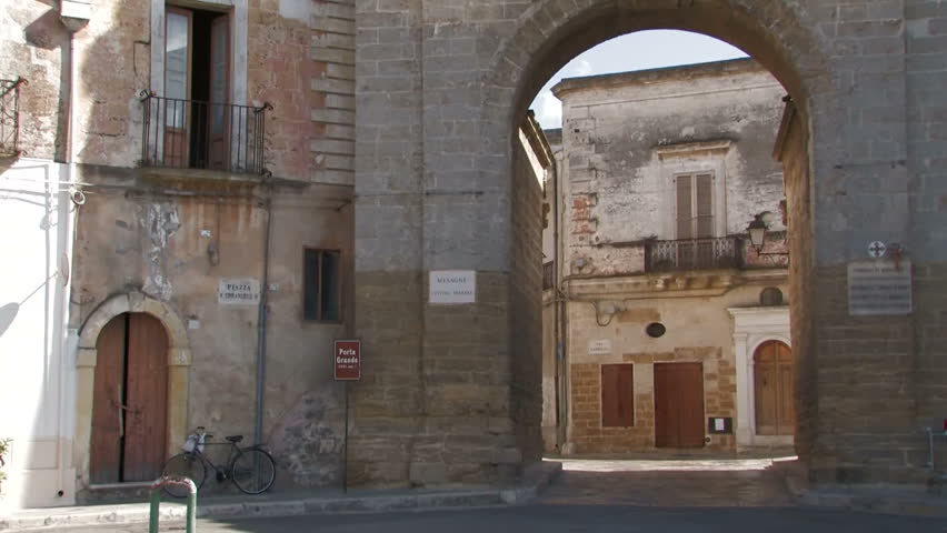 Medieval city gate into a village in southern Italy
