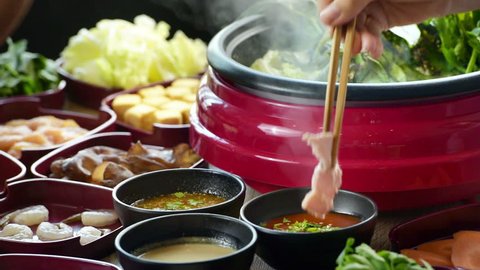 Enjoy eating Shabu Shabu and Sukiyaki in hot pot at japanese 
restaurant.Japanese food are high quality fresh food cooking in hot boil soup with vegetable beef raw meat or sea food hold with chopstick