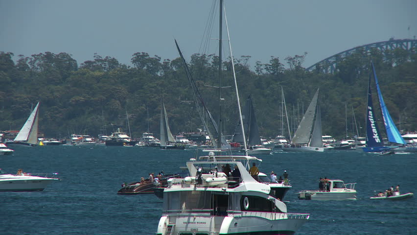 Two super maxi yachts tacking along Sydney Harbor