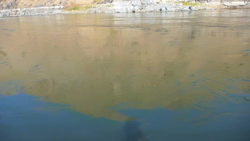 Point of view of person jumping into Snake River in Hells Canyon.