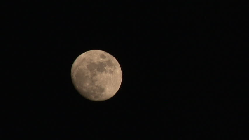 Waxing gibbous moon (almost full) gets obscured by clouds moving from the right