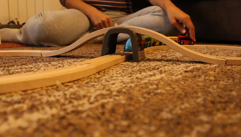 playing with toys on the carpet