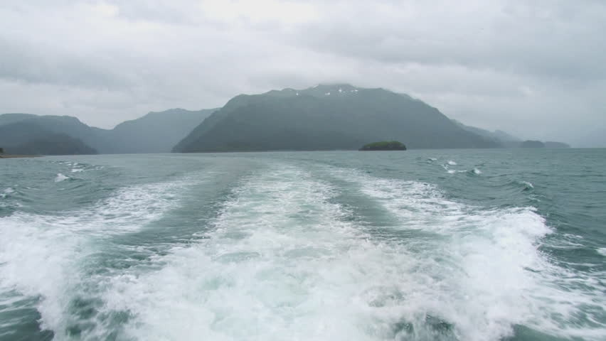 Cloudy day, looking aft from a tour boat in the Eldred Passage near Seldovia,