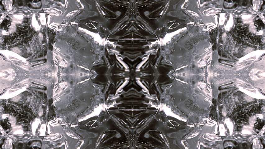 Rotating close-up, in kaleidoscopic quad pattern. Unfolding. Based on strange