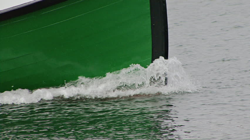 Close shot to tighter (boat moves closer and slight zoom at beginning)of wooden