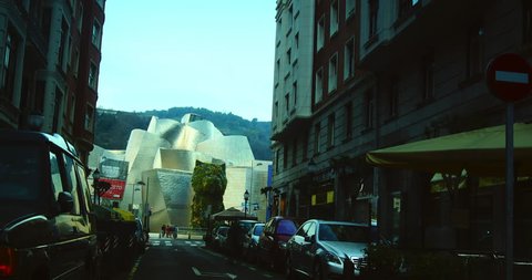 BILBAO, SPAIN - JULY 4, 2017: Guggenheim Museum Bilbao is museum of modern and contemporary art, designed by Canadian-American architect Frank Gehry. Bilbao, Basque Country, time lapse, zoom out