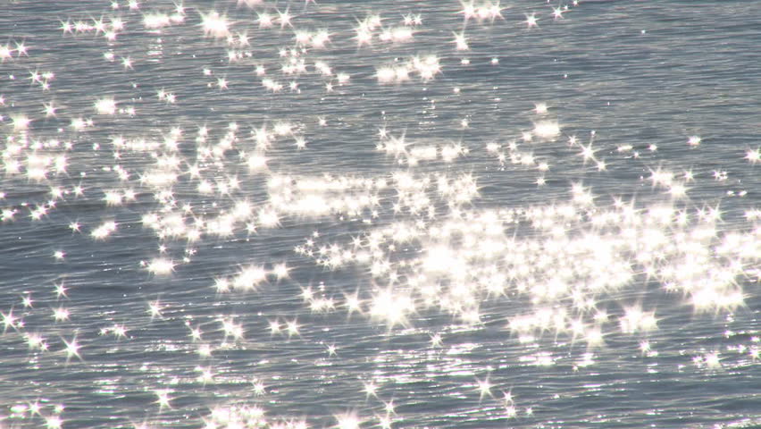 Sunlight cast into a billion glittering stars on waves.