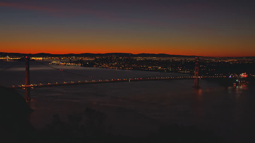 Colorful predawn over San Francisco and the Golden Gate Bridge. Time-lapse.