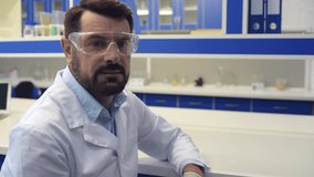 Bearded scientist posing for camera confidently
