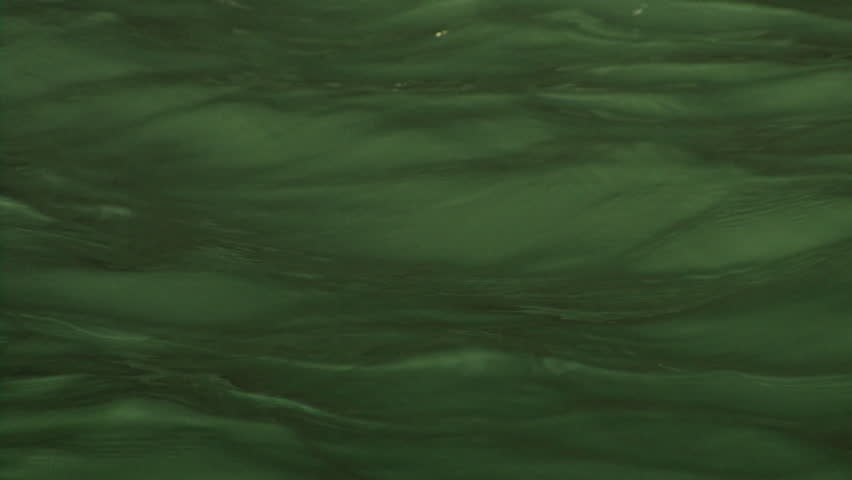 Glowing Emerald Green Rippling Water Background