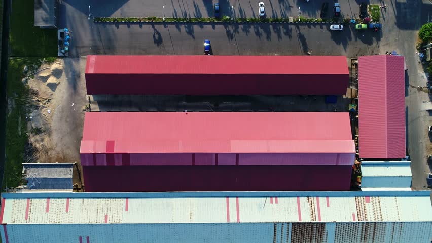 An aerial view of fishing boat docking to load and offloading fishes.