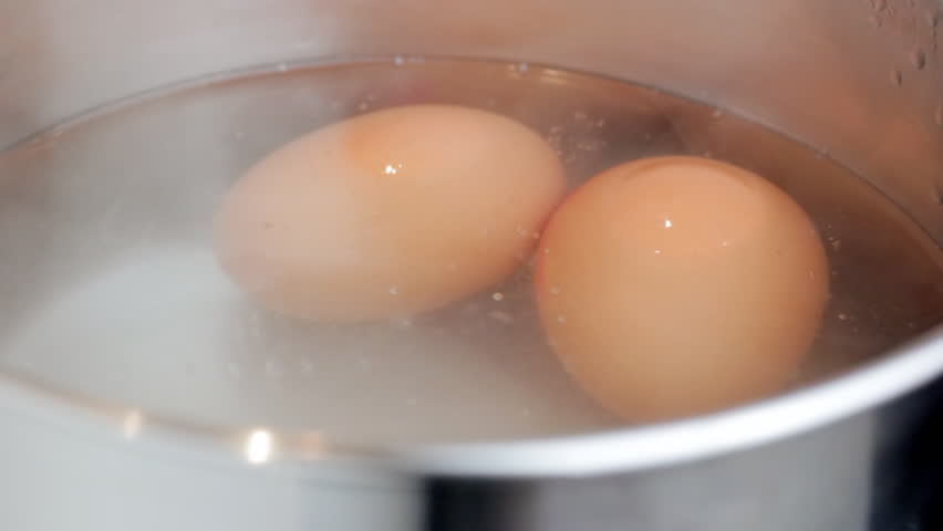 Boiling eggs in saucepan