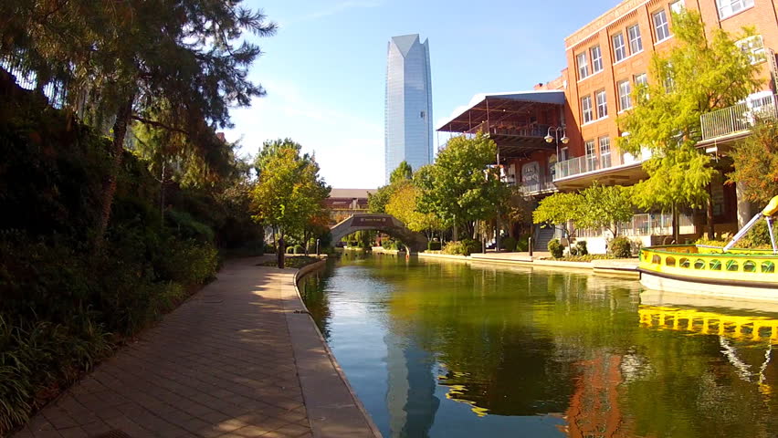 A section of the Oklahoma City Riverwalk or River Walk with a downtown office