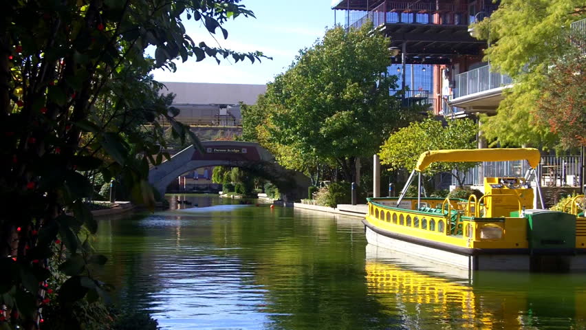 A section of the Oklahoma City Riverwalk or River Walk with a tour boat in
