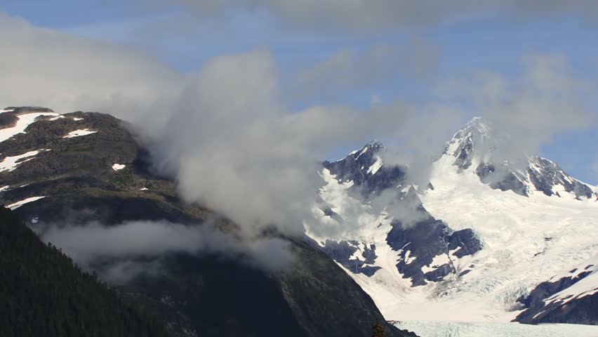 Craggy mountain peaks over Billings Glacier near Whittier, Alaska, wreathed by