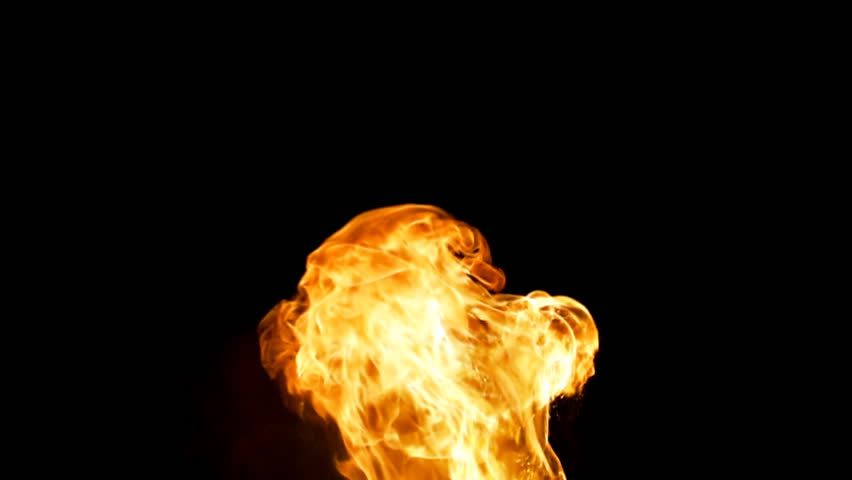 Several pulses of fiery flame making strange shapes against black background.