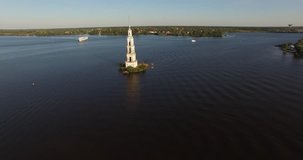 4K high quality aerial video footage of partly submerged Nikolskiy/St. Nicholas cathedral bell tower off the shore Kalyazin town on great Volga river, Golden Ring route 200 km from Moscow, Russia