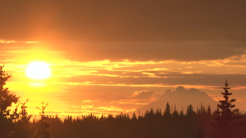 Northern summer sunset over Mt. Redoubt, an active volcano in Alaska