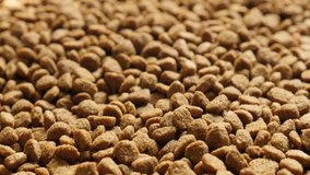 Tilting on extruded pellet meal for domestic animals 4K 2160p 30fps UltraHD footage - Slow tilt on pile of pet dry food 3840X2160 UHD video