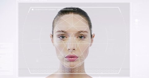 Futuristic and technological scanning of the face of a beautiful woman for facial recognition and scanned person. It can serve to ensure personal safety. Concept of:  future, security, scanning.