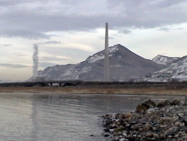 Video of the Kennecott Copper mine refinery on the shore of the Great Salt lake in Utah. Tall tower. 