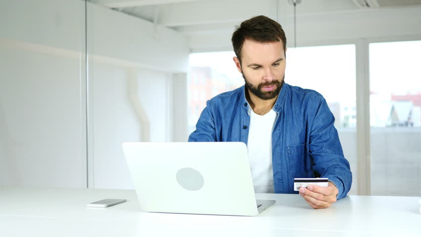 Beard young Man Buying Online On Laptop, Payment | Shutterstock HD Video #31125955