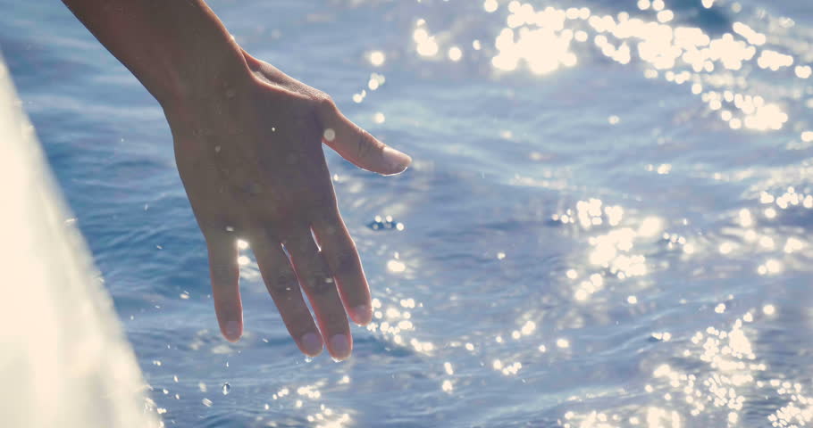 
Slow motion of a female hand is touching a clear transparent water and enjoys the day at the sea alongside the waves of the boat. Concept of happiness, boat life and holidays in exotic places Royalty-Free Stock Footage #31131262
