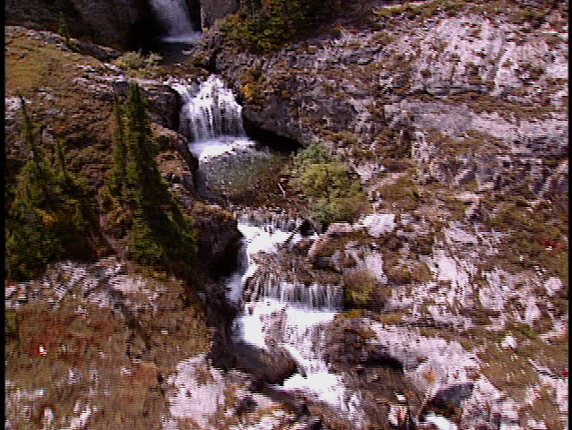 Low level aerial fly over Ribbon Creek all the way up to Ribbon Lake in Kananaskis Park Canada